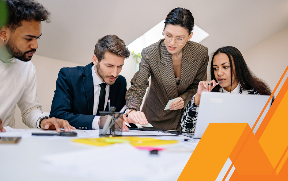 A team at work, discussing Autism Awareness Month.